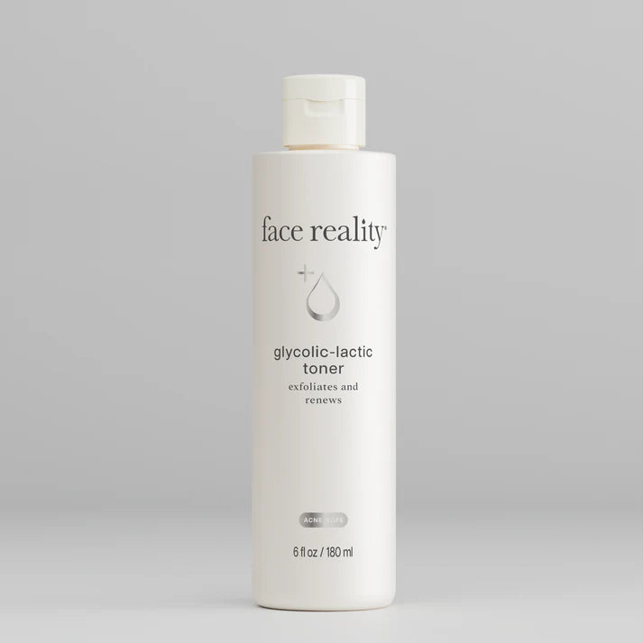 Bottle of 'face reality' glycolic-lactic toner on a gray background