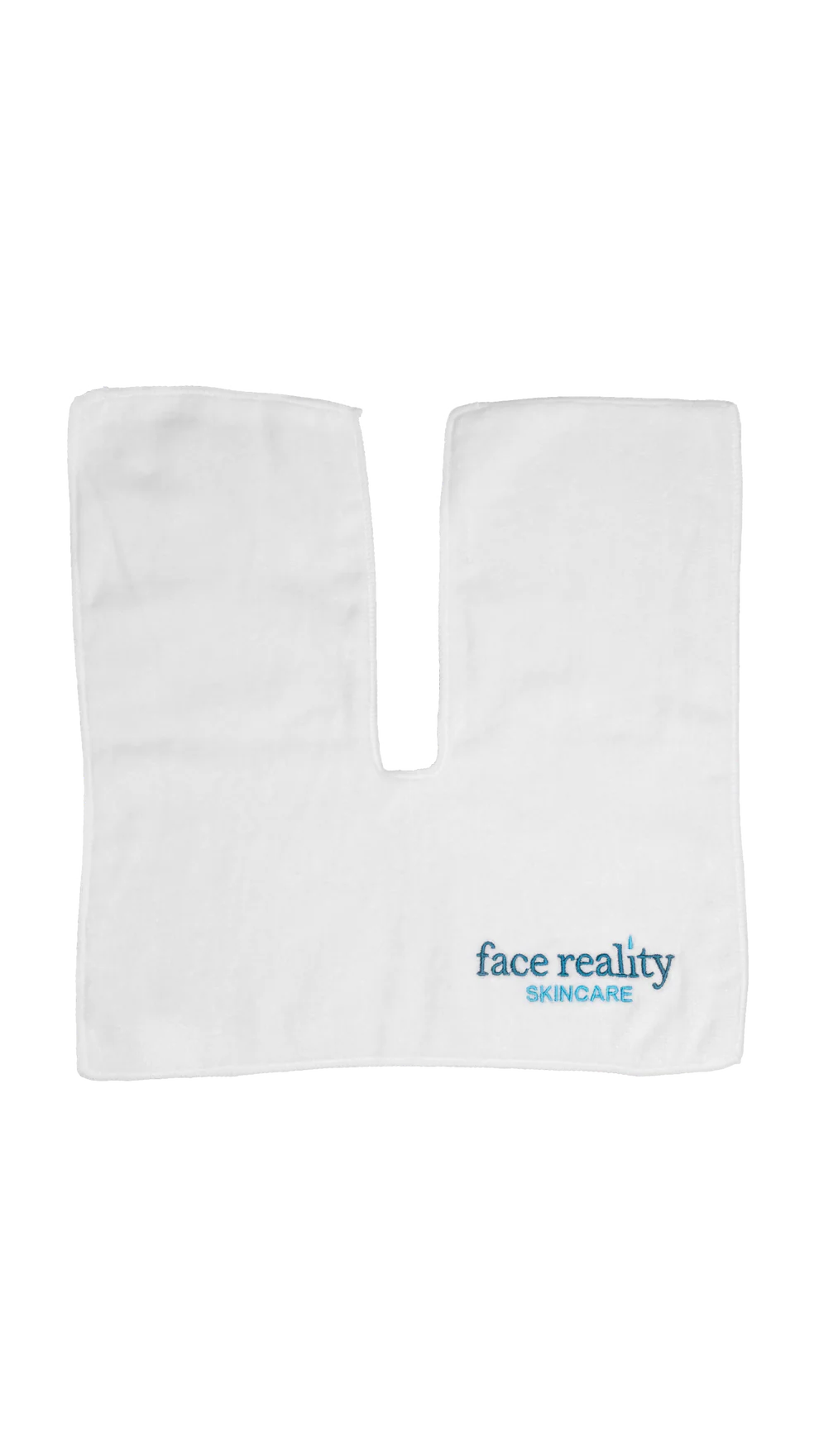 White treatment towel with the words 'face reality skincare'