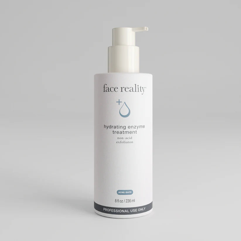 Bottle of 'face reality' hydrating enzyme treatment on a gray background