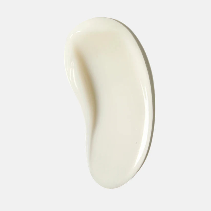 Beige-colored skin care swatch on a light gray background