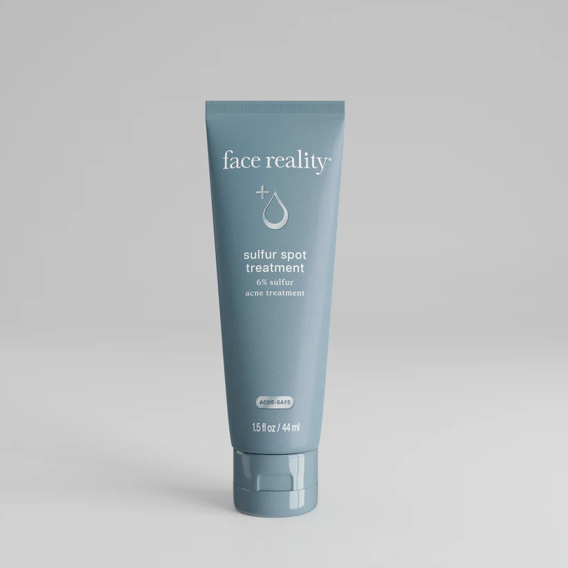 Blue tube of 'face reality' sulfur spot treatment 6% sulfure acne treatment on a gray background