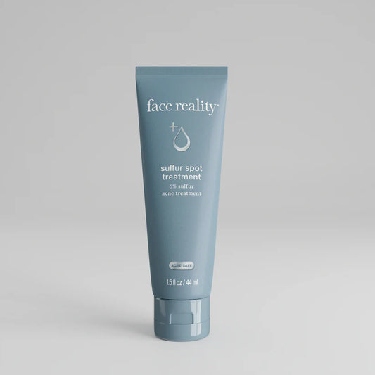 Blue tube of 'face reality' sulfur spot treatment 6% sulfur acne treatment on a gray background
