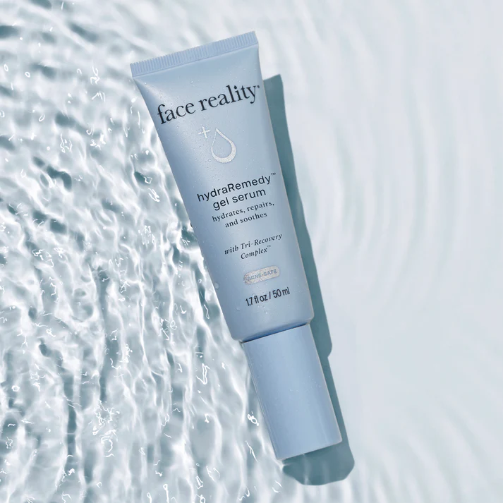 Tube of 'face reality' hydra remedy gel serum on a textured water-like background