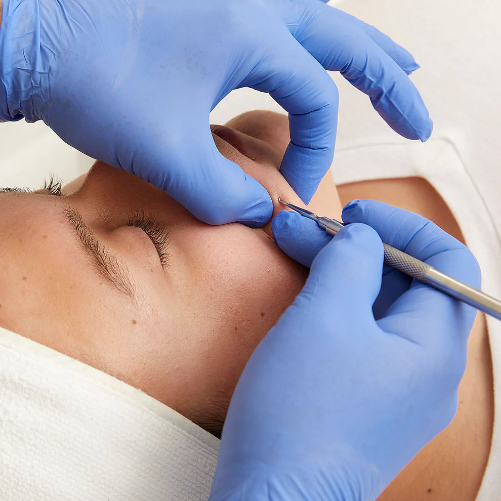 Person getting a facial treatment with the Preston Rxtractor tool