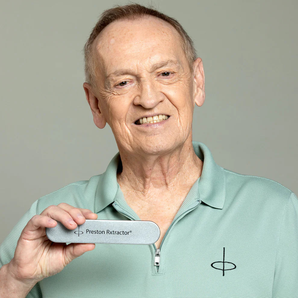 Man holding a 'Preston Rxtractor' device