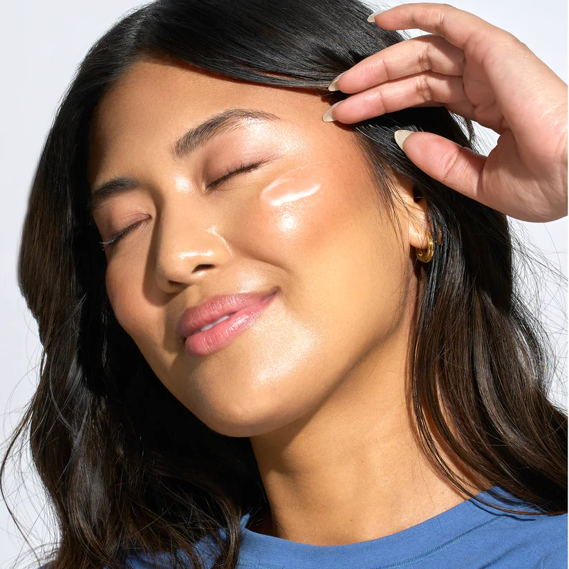 Woman with sunscreen on her face